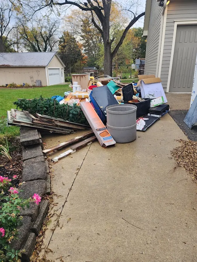 Dumpster being loaded with debris for Estate Cleanout Dumpster Rental in Wappinger